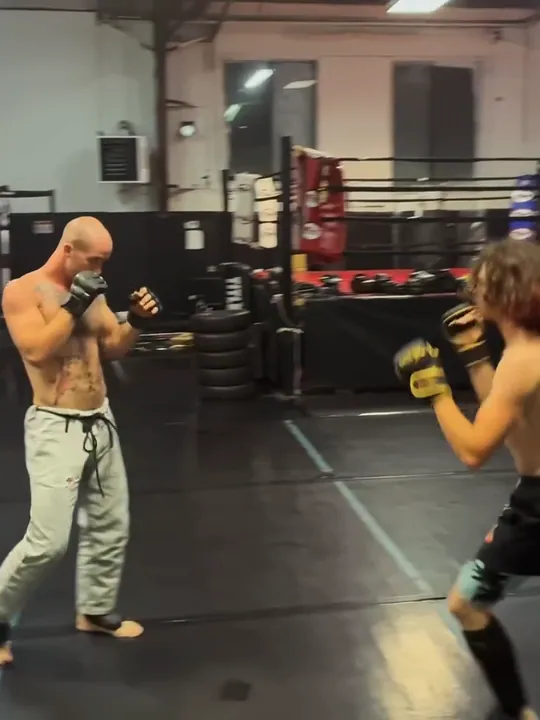 Nathan Johnson kickboxing with a training partner