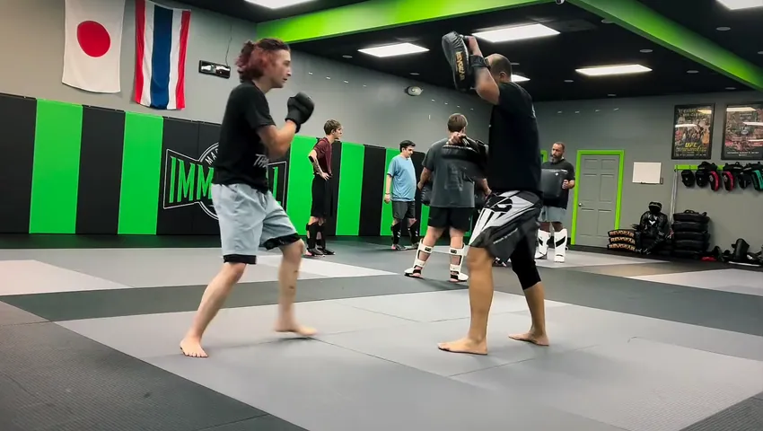 Nathan Johnson kicking the pads at Immortal Martial Arts